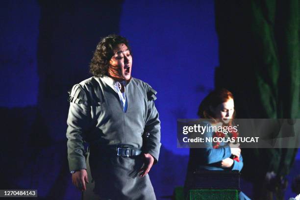 Tenor Woo Kyung Kim playing the role of Faust and Maira Kerey playing Marguerite perform during the rehearsal of the opera "Faust" by Charles Gounod,...