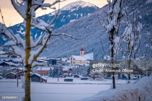winter morning cityscape in the austrian town of neustift. - neustift im stubaital stock pictures, royalty-free photos & images
