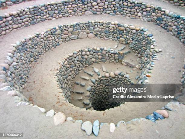 spiral holes known as "puquios" - nazca stock-fotos und bilder