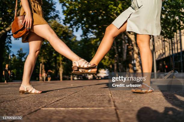 greeting with foot tap during pandemic - open toe stock pictures, royalty-free photos & images