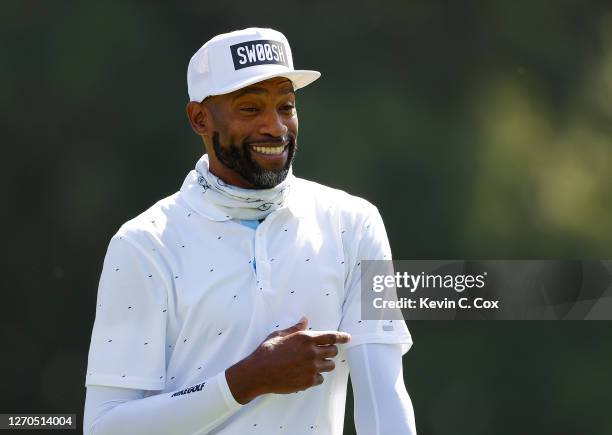 Newly retired NBA player Vince Carter enjoys a laugh on the 17th hole during the "Golf With a Purpose" Charity Challenge at East Lake Golf Club on...