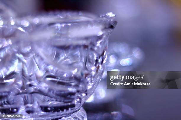 crystal bowl in purple light. - kristallglas stock-fotos und bilder
