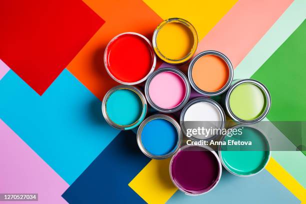 various bright paints on colorful background - tinta equipamento de arte e artesanato - fotografias e filmes do acervo