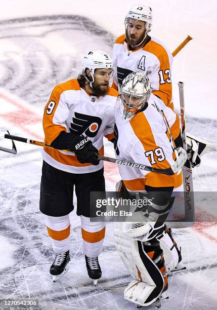 Ivan Provorov and Carter Hart of the Philadelphia Flyers celebrate the teams 5-4 victory during the second overtime period against the New York...