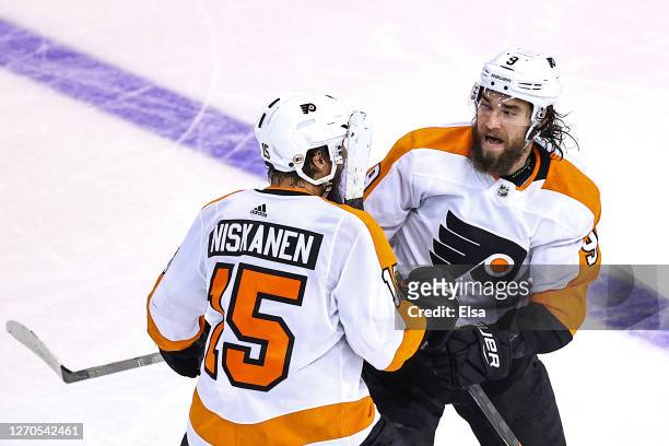Ivan Provorov of the Philadelphia Flyers is congratulated by his teammate Matt Niskanen after scoring the game-winning goal during the second...