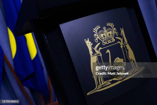 The Coat of Arms of Western Australia is displayed on a podium as Western Australian Premier Mark McGowan conducts his media conference at Dumas...