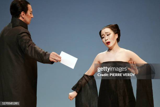 Opera chinese soprano Liping Zhang as Cio-Cio San and Dwayne Croft as Sharpless, perform 20 January 2006 on the stage of the Opera Bastille in Paris,...