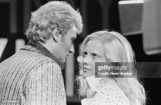 French singer and actor Johnny Hallyday with wife Bulgarian-born French singer Sylvie Vartan on the set of a televised show.