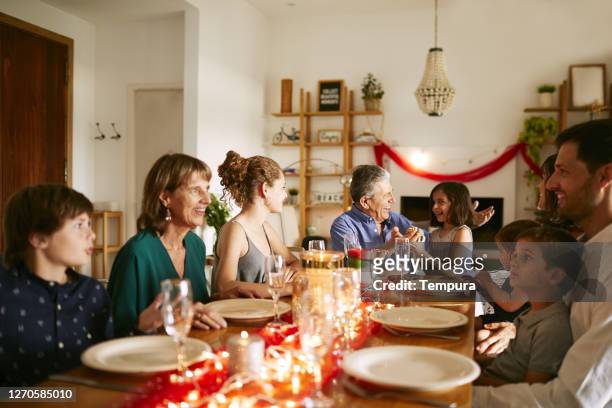 family sharing the christmas table in buenos aires - argentina traditional food stock pictures, royalty-free photos & images