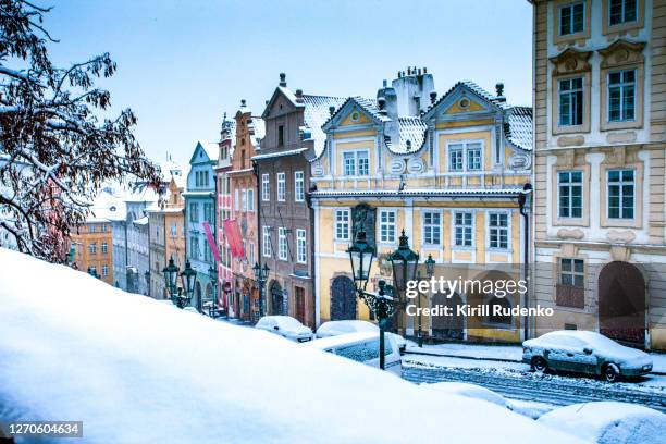 old town covered in snow, prague, czech republic - stone town stock pictures, royalty-free photos & images