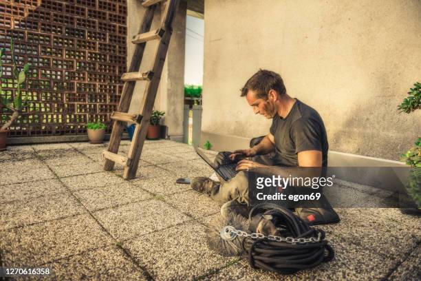 chimney sweeper making receipt for customer - chimney sweep stock pictures, royalty-free photos & images