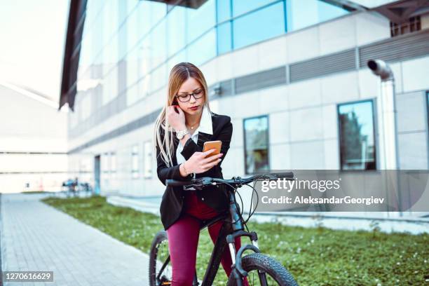 businesswoman taking selfie with bicycle - classic press conference stock pictures, royalty-free photos & images