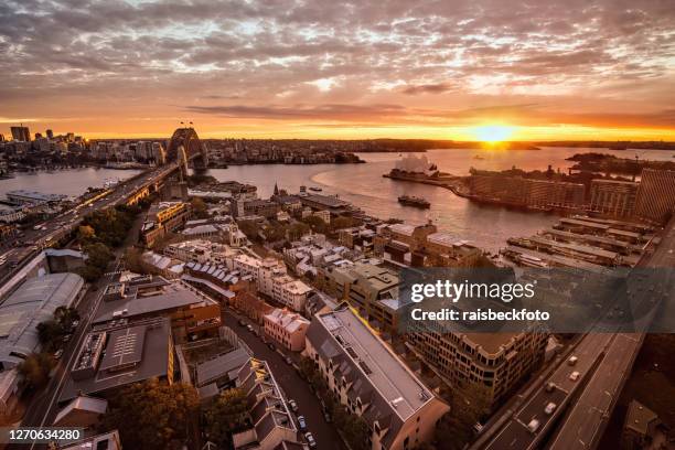 sunrise over sydney harbour in sydney, australia - the rocks sydney stock pictures, royalty-free photos & images