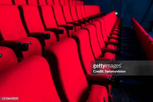 red seats in theather - musical stock-fotos und bilder