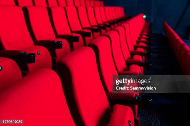 red seats in theather - festival de film fotografías e imágenes de stock