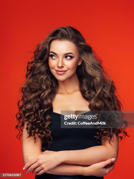 beautiful woman with voluminous curly hairstyle - hair model stock pictures, royalty-free photos & images