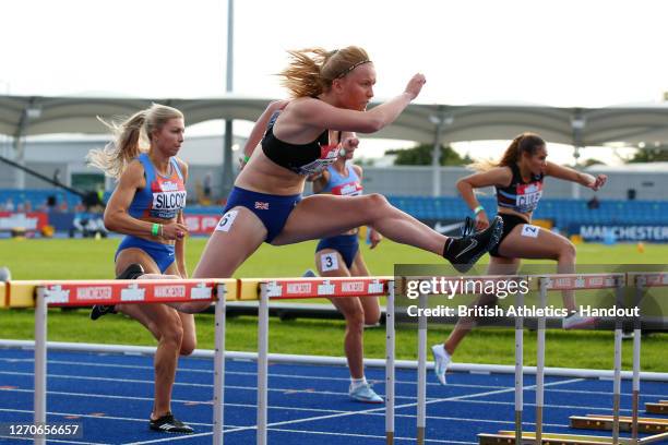 In this handout image provided by British Athletics, Lucy-Jane Matthews of Great Britain takes part in the Women's 100 Metres Hurdles during day one...