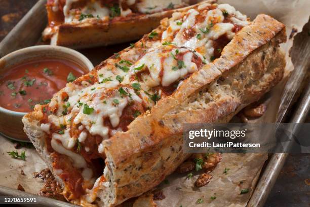 baked meatball sub on a herb baguette - sub sandwich stock pictures, royalty-free photos & images