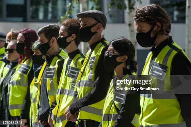 Extinction rebellion activists protest against climate change and the plight of refugees outside the Home Office on September 4, 2020 in London,...