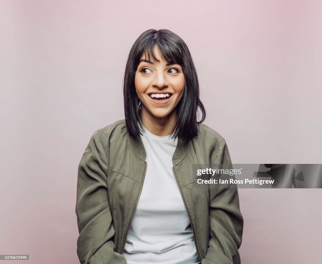Cute Latina woman looking surprised