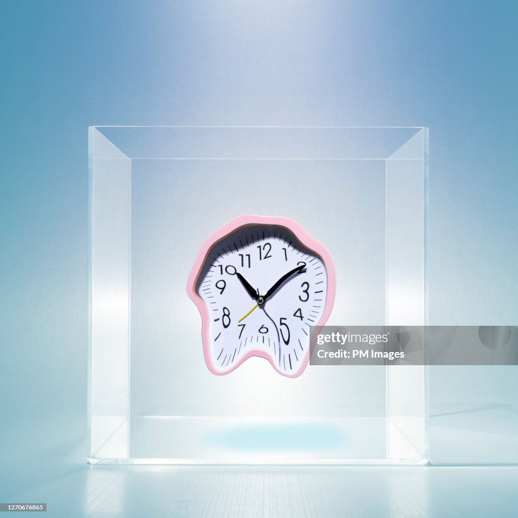Melting clock in clear box