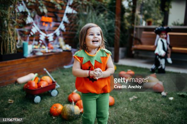 playful kids enjoying a halloween party - halloween stock pictures, royalty-free photos & images