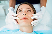 Cosmetologist preparing for facial treatments