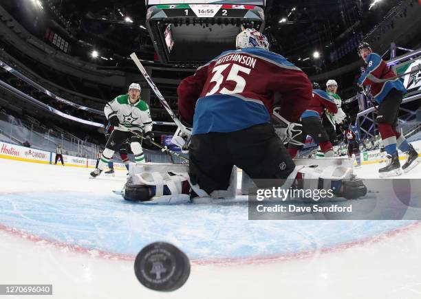 Joel Kiviranta of the Dallas Stars deflects the puck for a goal past goaltender Michael Hutchinson of the Colorado Avalanche in the second period of...