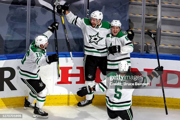 Joel Kiviranta of the Dallas Stars is congratulated by his teammates after scoring the game-winning goal against the Colorado Avalanche during the...