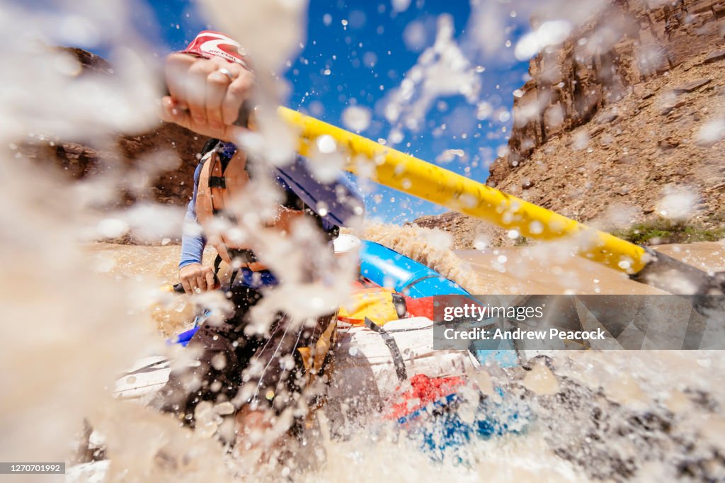 Person Rowing A Raft A Man Is Rowing A Raft Through A Rapid On The Colorado River High-Res ...