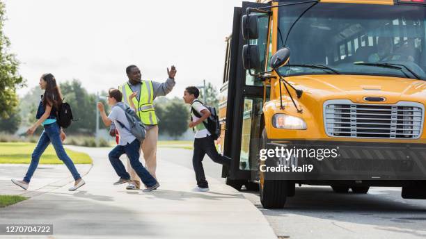 middle school students exit bus, boy with down syndrome - leaving school imagens e fotografias de stock