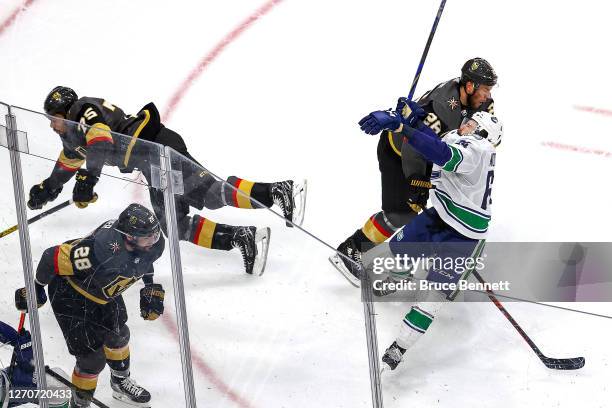 Tyler Motte of the Vancouver Canucks is hit and injured by Ryan Reaves of the Vegas Golden Knights during the second period in Game Seven of the...