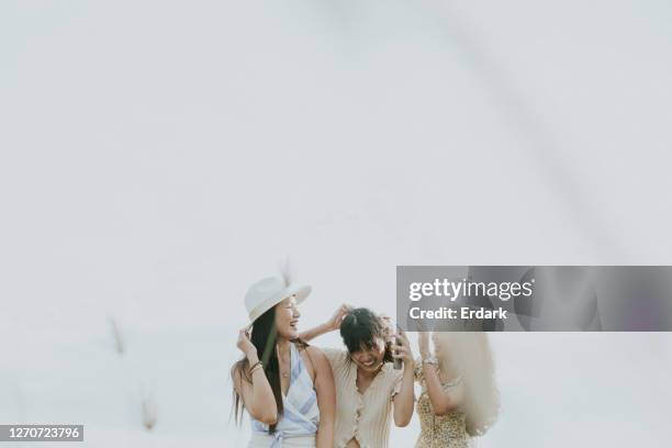 happiness girls with a clear sky on a simply day. - friendship background stock pictures, royalty-free photos & images