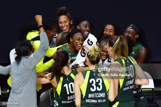 Jewell Loyd of the Seattle Storm celebrates with teammates Sue Bird, Sami Whitcomb, Breanna Stewart, and Epiphanny Prince after hitting a buzzer...