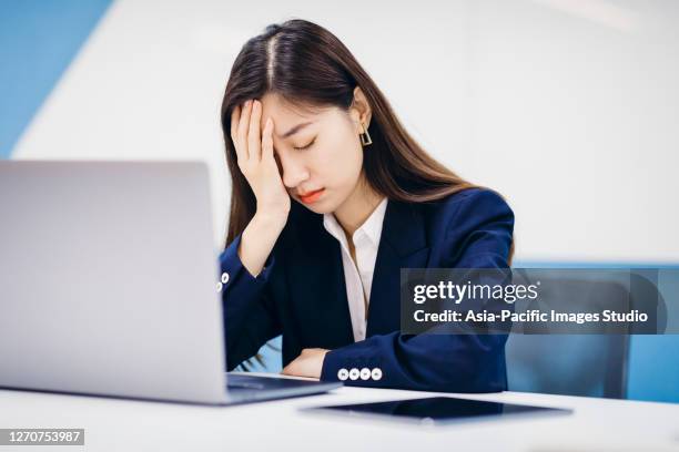 professional asian businesswoman working in office. - japanese people laptop unhappy stock pictures, royalty-free photos & images