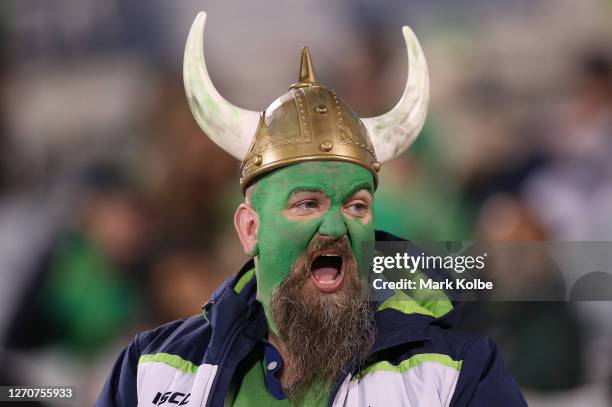 Raiders fan cheers during the round 17 NRL match between the Canberra Raiders and the Sydney Roosters at GIO Stadium on September 05, 2020 in...