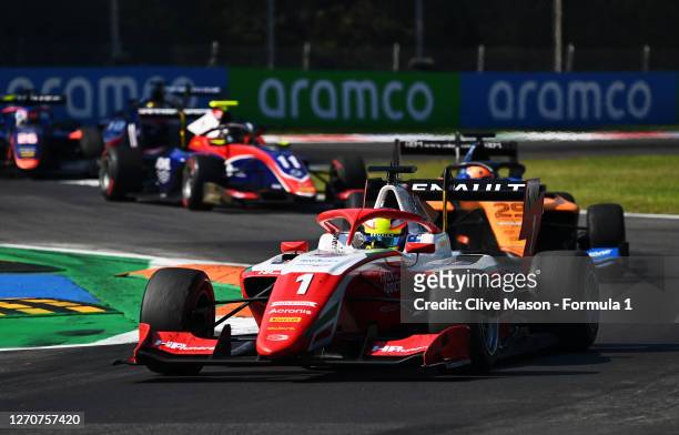 Oscar Piastri of Australia and Prema Racing leads Alex Peroni of Australia and Campos Racing during race one of the Formula 3 Championship at...