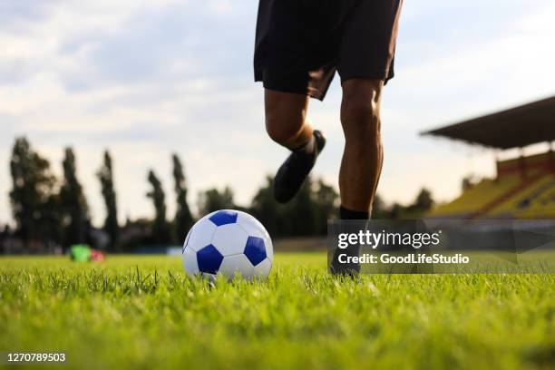 free kick - football player silhouette stock pictures, royalty-free photos & images