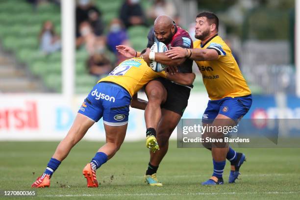 Paul Lasike of Harlequins is tackled by Cameron Redpath and Lewis Boyce of Bath Rugby during the Gallagher Premiership Rugby match between Harlequins...