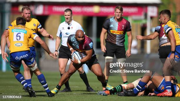 Paul Lasike of Harlequins takes on the Bath Rugby defence during the Gallagher Premiership Rugby match between Harlequins and Bath Rugby at...