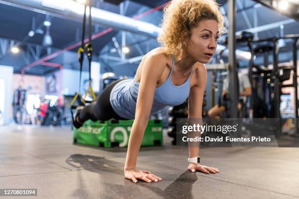 young blonde woman training at the gym - fitness center ストックフォトと画像