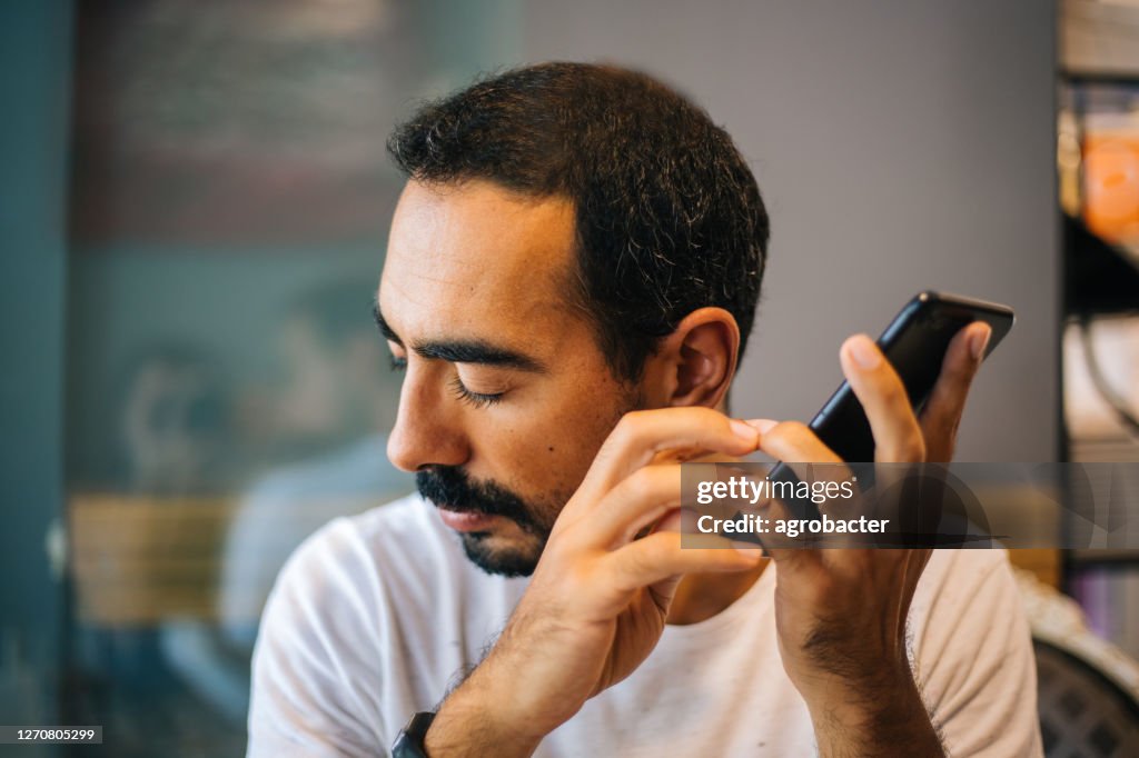 Blind man using technology