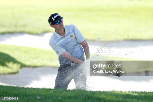 John Catlin of The United States chips onto the 18th green during day three of the Estrella Damm N. A. Andalucia Masters golf tournament at Real Club...