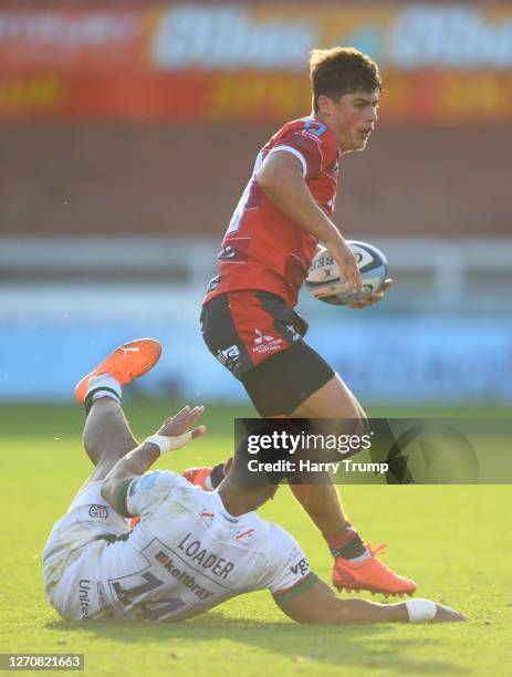 Louis Rees-Zammit of Gloucester Rugby is tackled by Ben Loader of London Irish during the Gallagher Premiership Rugby match between Gloucester Rugby...