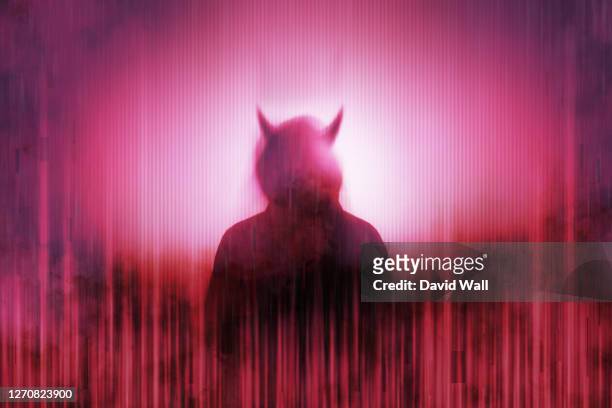 silhouette of a mysterious horned devil figure without a face, surrounded by a glitch, red, neon edit - devil stock pictures, royalty-free photos & images