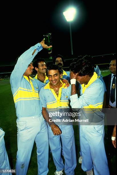 The Indian team celebrate after winning the World Championship match against Pakistan at the Melbourne Cricket Ground in Australia. \ Mandatory...