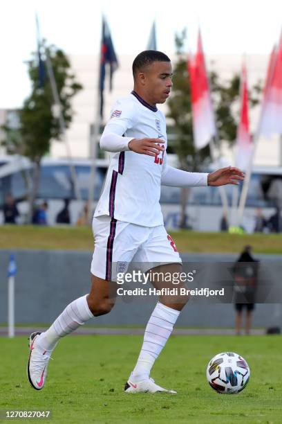 Mason Greenwood of England runs with the ball during the UEFA Nations League group stage match between Iceland and England at Laugardalsvollur...