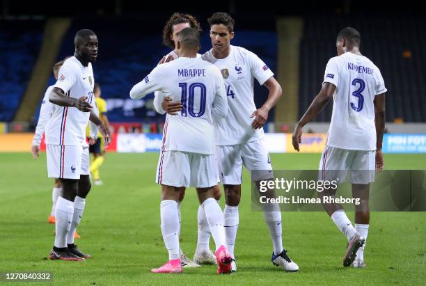 Kylian Mbappe of France celebrates after with his team mates after scoring his team's first goal during the UEFA Nations League group stage match...