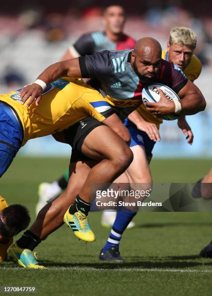 Paul Lasike of Harlequins is tackled by Tom Ellis of Bath Rugby during the Gallagher Premiership Rugby match between Harlequins and Bath Rugby at...