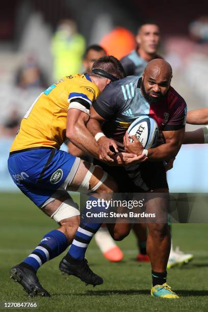 Paul Lasike of Harlequins is tackled by Tom Ellis of Bath Rugby during the Gallagher Premiership Rugby match between Harlequins and Bath Rugby at...